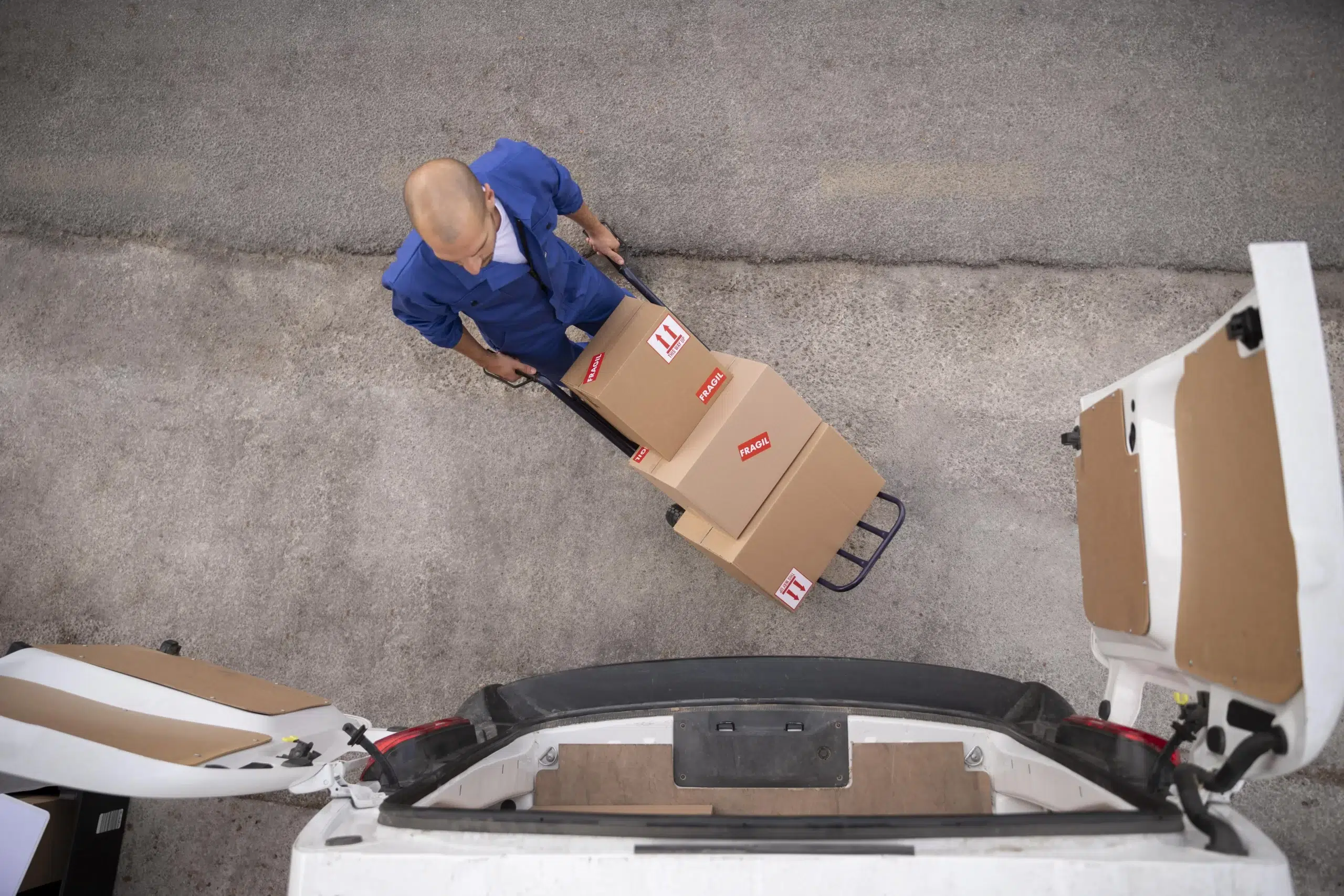 full-shot-delivery-man-carrying-boxes-top-view_result